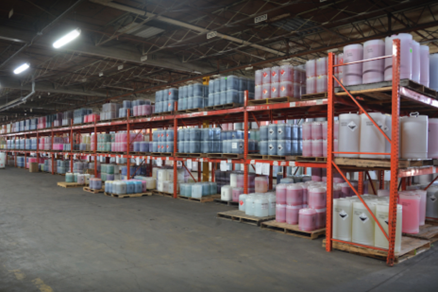 Cul-Mac warehouse and manufacturing facility in Wayne, Michigan with shelves stocked with chemical products
